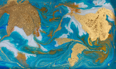 Golden Dust on Liquid Blue Ink Wave Background.の写真素材