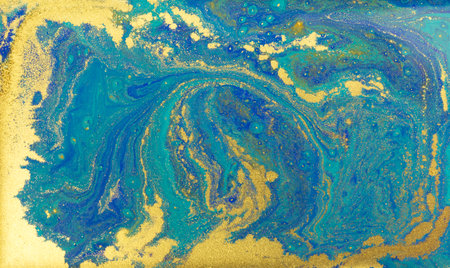 Blue and Golden Dust Placer on Liquid Blue Ink Background.の写真素材