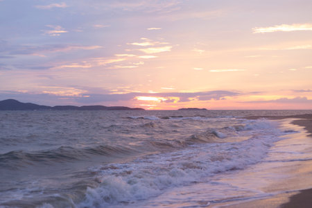 Raging Sea with Sunset Sky Backgroundの写真素材