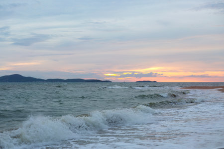 Raging Sea with Sunset Sky Backgroundの写真素材