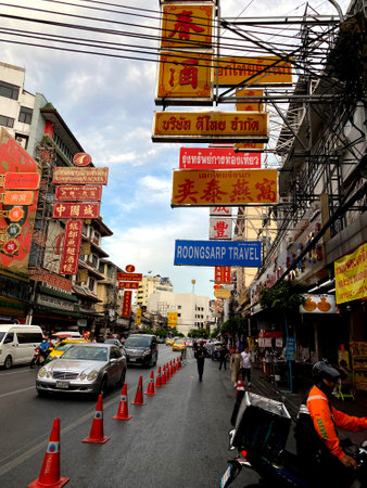 Bangkok, Thailand - June, 05, 2023; Cars and shops on Chinatown Roadのeditorial素材