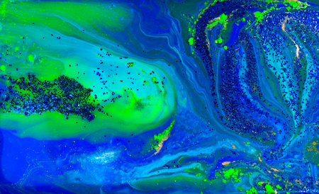 Blue and Gold Glitter on Liquid Blue Ink Abstract Background.の写真素材