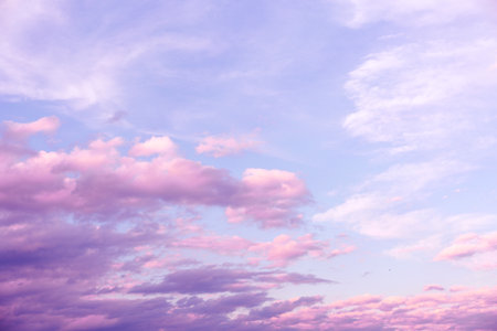 Sunrise Light Pink and Purple Clouds on Blue Skyの写真素材