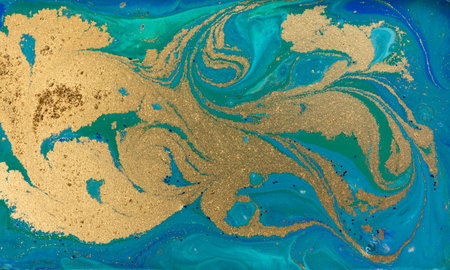 Golden Sand on Liquid Blue Inks Backgroundの写真素材