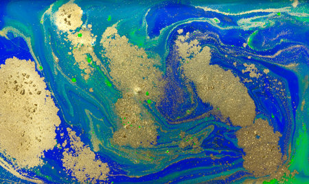 Blue and Golden Dust Placer on Liquid Blue Ink Background.の写真素材