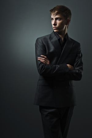handsome man in a business suit on a dark backgroundの写真素材