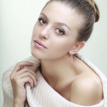 beautiful girl with perfect skin on a light backgroundの写真素材
