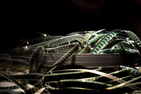 Filmstrips in a can on a black backgroundの写真素材