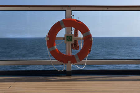 a rescue bouy ona boat at seaのeditorial素材