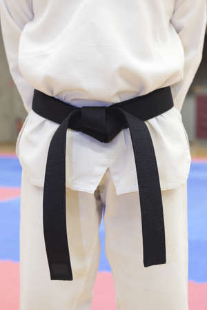 a men wearing a black belt in taekwondo の写真素材