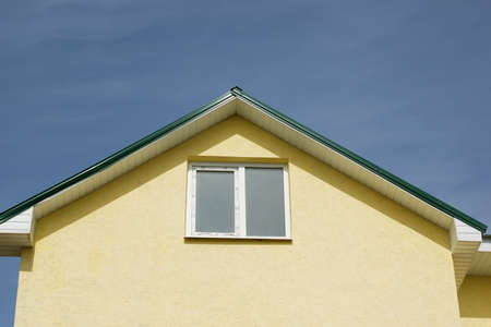Roof of a home against blue sky