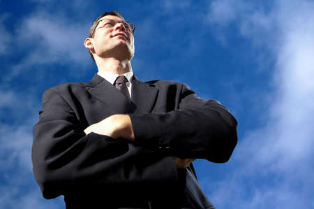  Satisfied  professional with eyeglasses on sky background.                                の写真素材