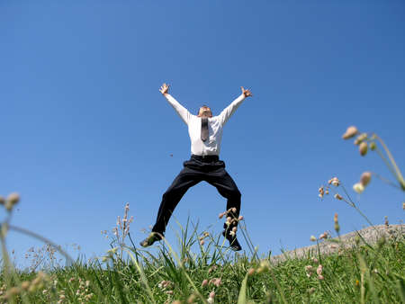 Businessman jumping in the air with success      の写真素材