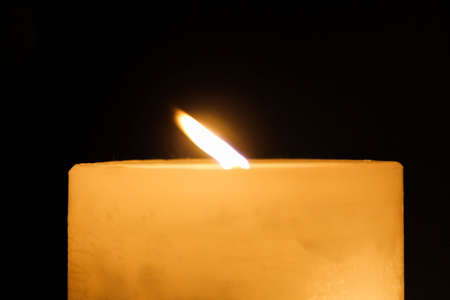 The one candle in dark backgroundの写真素材