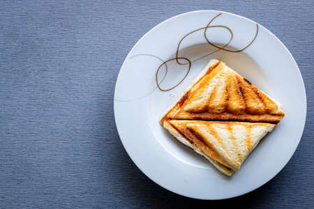 top view square toast sandwich in the white dish on marble boardの写真素材