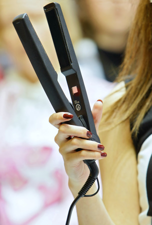 The woman makes hair stylingの写真素材