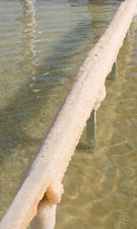 Handrail with salt from the Dead Sea. Dead Sea in Israelの写真素材