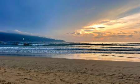 Sunset on the beach of My Khe, Da Nang, Vietnamの写真素材