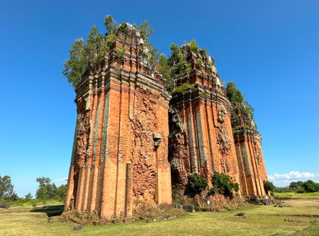 Duong Long Tower is a cluster of 3 ancient towers against the blue sky.の写真素材