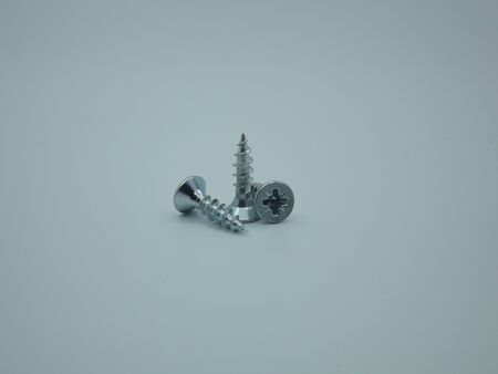 Photo of a screw on a white backgroundの写真素材