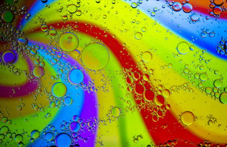Abstract colorful Background Oil in Water surface Foam of Soap with Bubbles macro shot close-up. Abstract background. Multicolored stains water stains.Image of oil drop on water for modernの写真素材