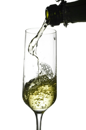 Splashing champagne isolated on white backgroundの写真素材