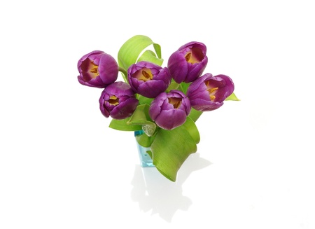 Pink tulips in vase on white backgroundの写真素材