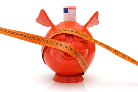 concept of no money with piggy bank and measuring tape の写真素材