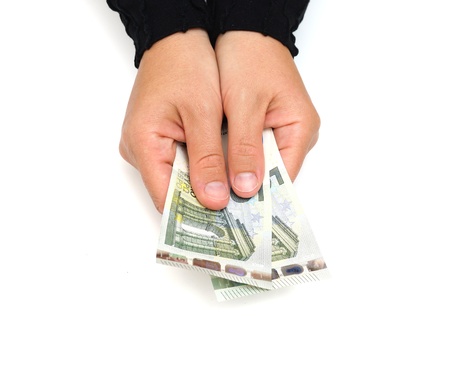 The female hand holds euro banknotesの写真素材