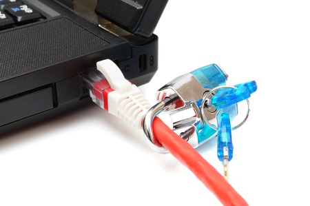 Internet security and network protection concept, padlock and connection plug in laptopの写真素材