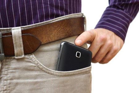 too big mobile phone in pantsの写真素材