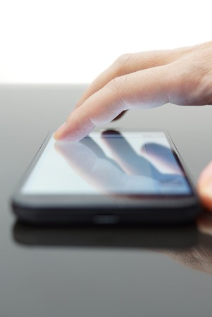 Young adult using mobile smart phone