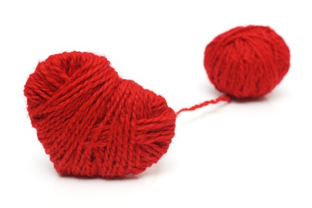 Yarn of wool in heart shape symbolの写真素材