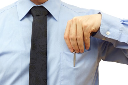 businessman is putting pen back into his pocketの写真素材