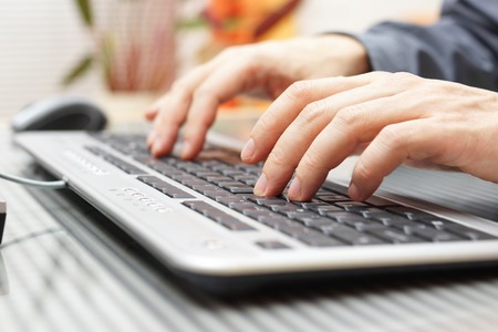 businessman  is typing on keyboardの写真素材