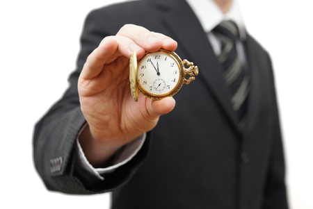 Businessman showing 5 minutes to twelveの写真素材
