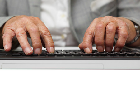 woman typing on computer keyboardの写真素材