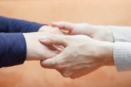male hands holding  girlfriend hands  Care and love conceptの写真素材
