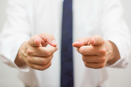 businessman pointing with fingers to youの写真素材