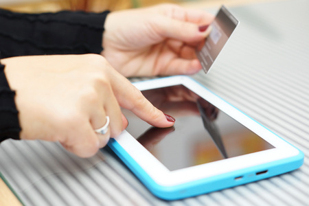Woman holding tablet pc and credit card , on line Shopping Conceptの写真素材