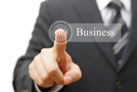 Businessman pressing  business  on virtual button, Business conceptの写真素材