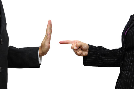 business woman pointing to coworker. He refuses taskの写真素材