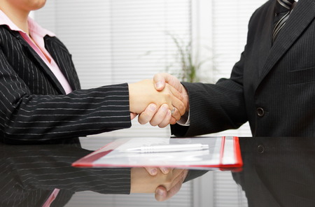 Lawyer and client are handshaking after successful meetingの写真素材