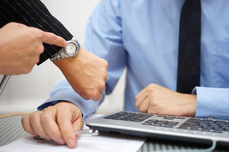 boss  is pressing on coworker about unfinished workの写真素材