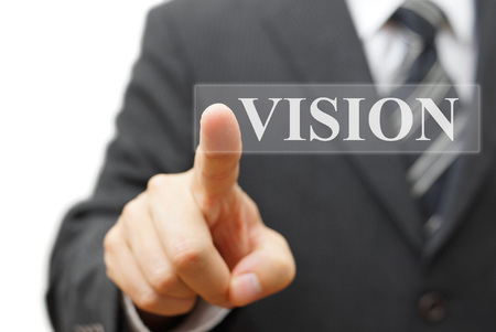 Businessman touching vision virtual buttonの写真素材