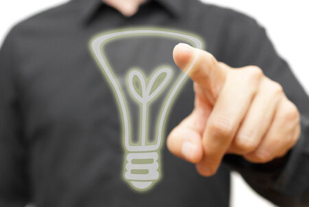 Businessman touching  virtual  light bulb. Concept of idea  or creativityの写真素材