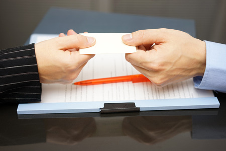 business partner is receiving business cardの写真素材