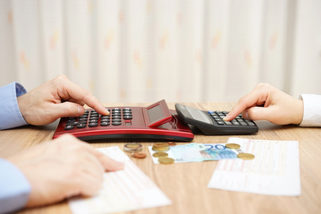 husband and wife are calculating monthly expenses. tight budget conceptの写真素材