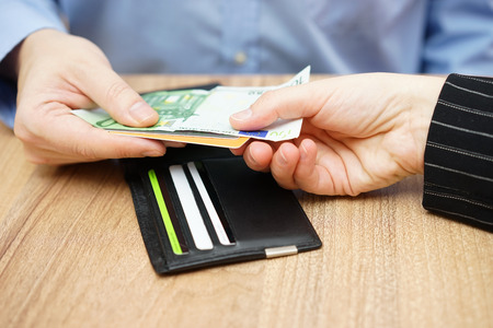 man must gives his  lover or wife money and credit cardsの写真素材
