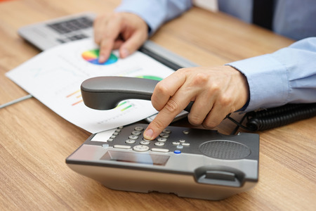 businessman calling client to inform him of the company's operationsの写真素材